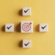 Image depicting a strategic framework with checkboxes and a target symbol, illustrating the importance of structured approaches in cyber security risk management NYC